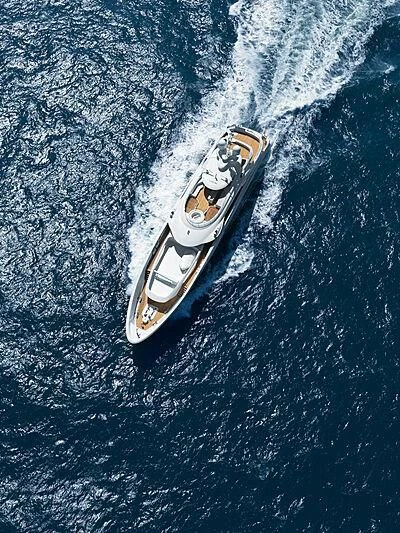 a silver guitar on a blue surface aboard ARKADIA Yacht for Charter