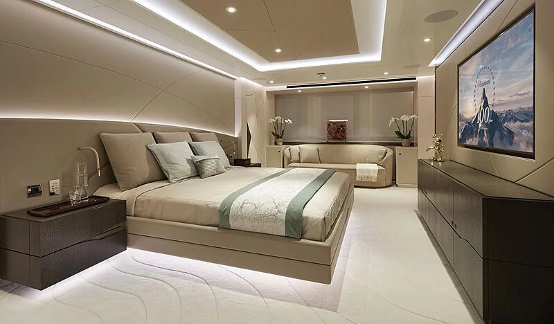 a room with a bed and a tv aboard ARKADIA Yacht for Charter