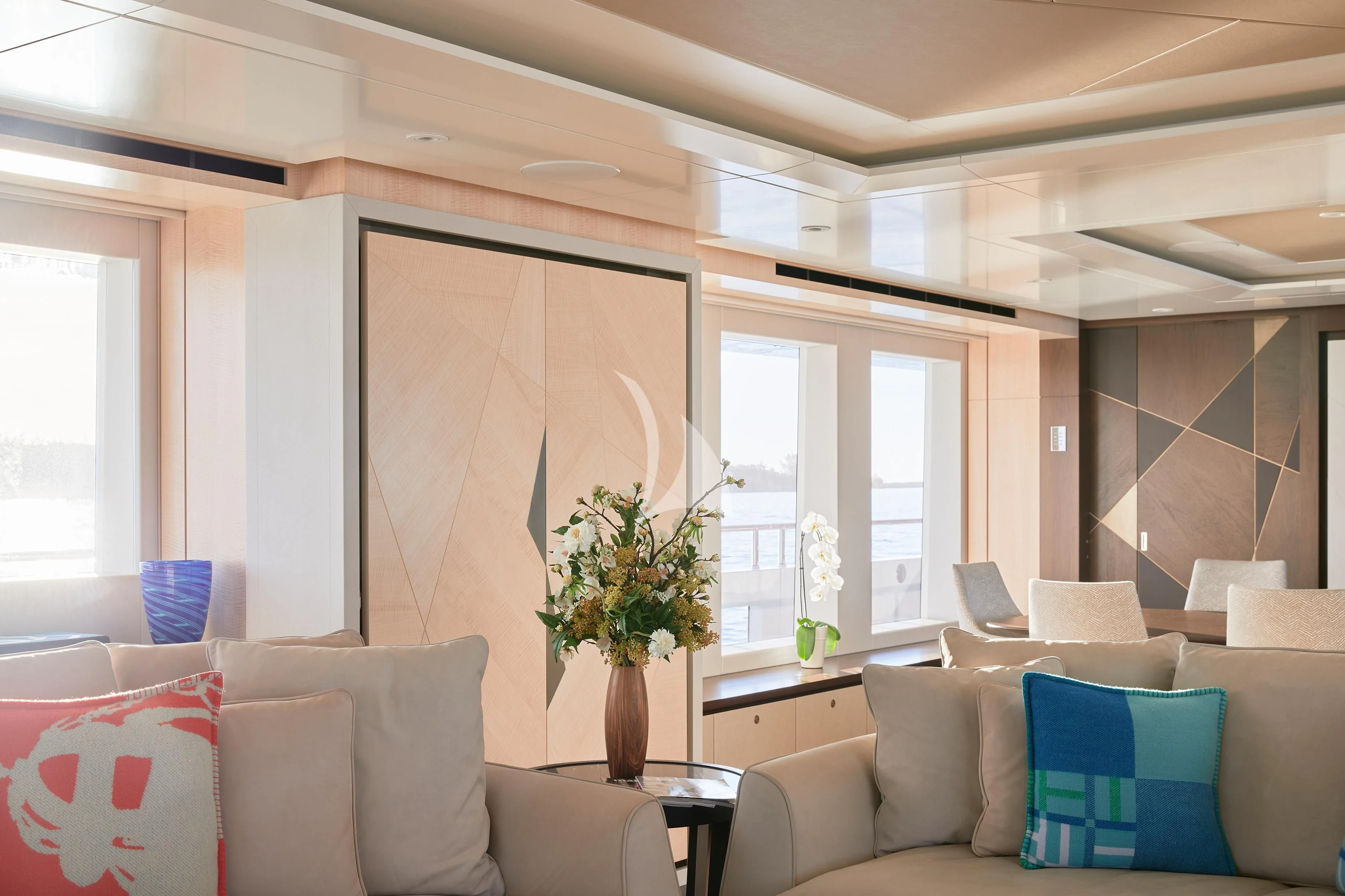 a living room with a large window aboard ARKADIA Yacht for Charter