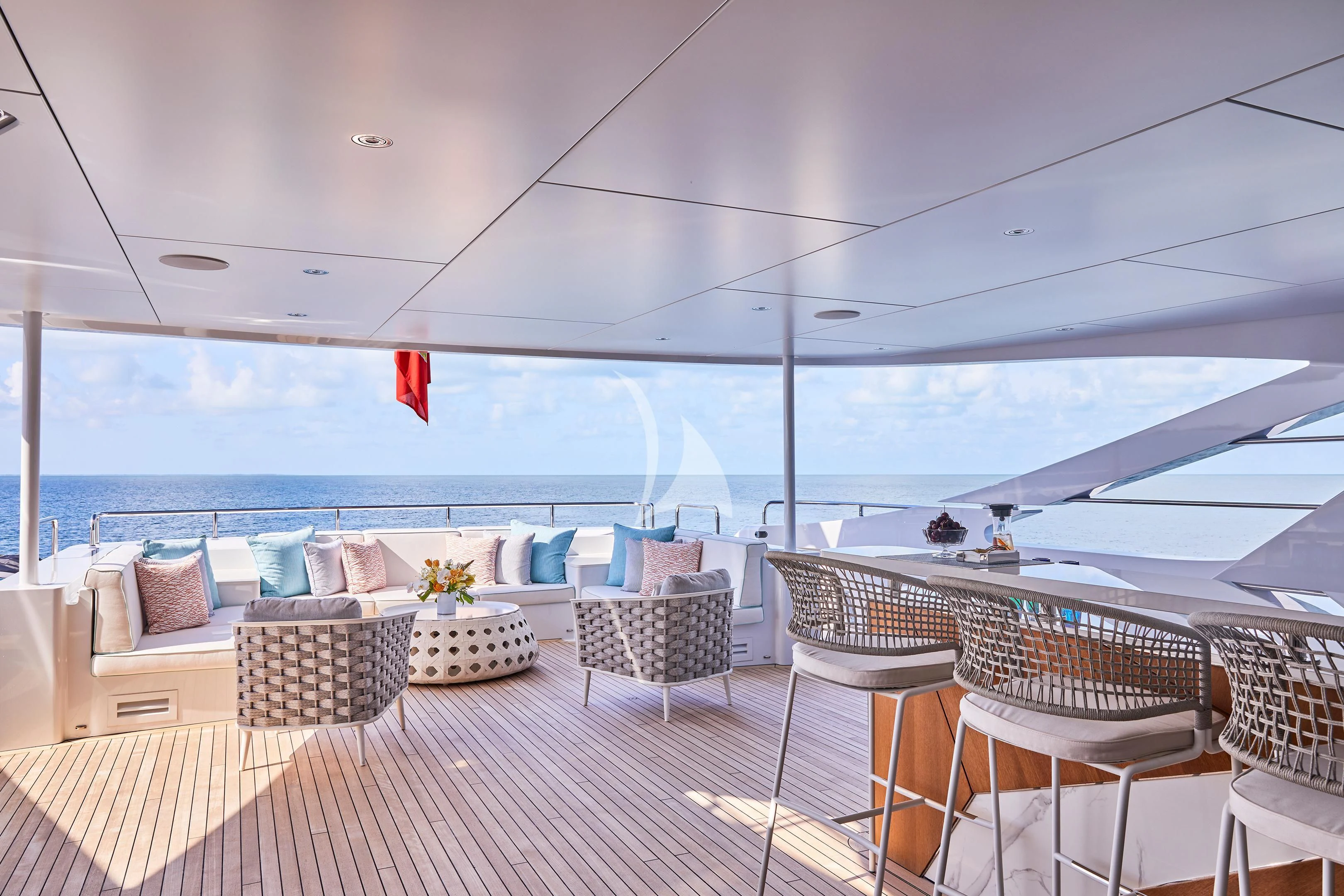 a patio with chairs and tables aboard ARKADIA Yacht for Charter