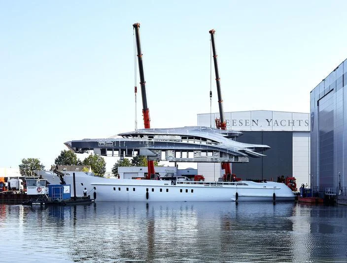 a large white boat docked aboard ARKADIA Yacht for Charter