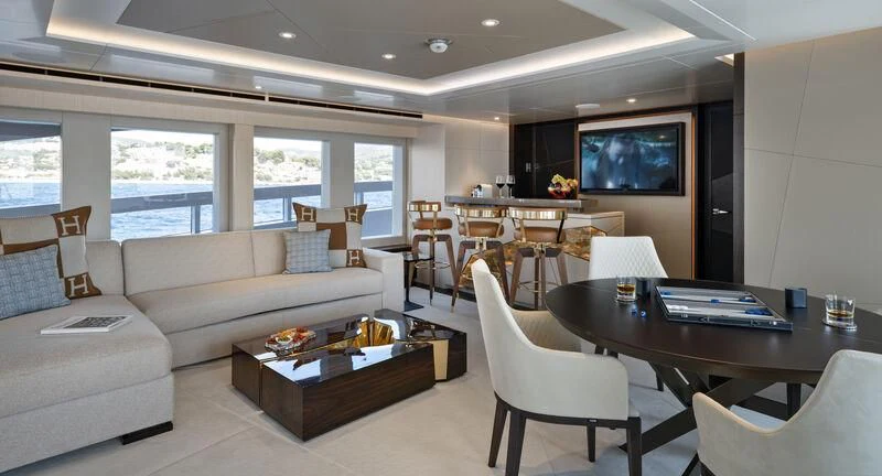 a living room with a couch and a table aboard ARKADIA Yacht for Charter