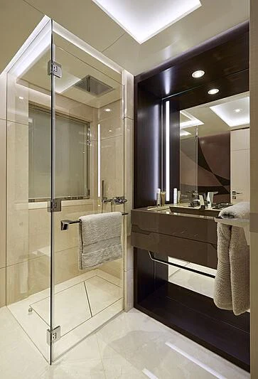 a bathroom with a glass shower aboard ARKADIA Yacht for Charter