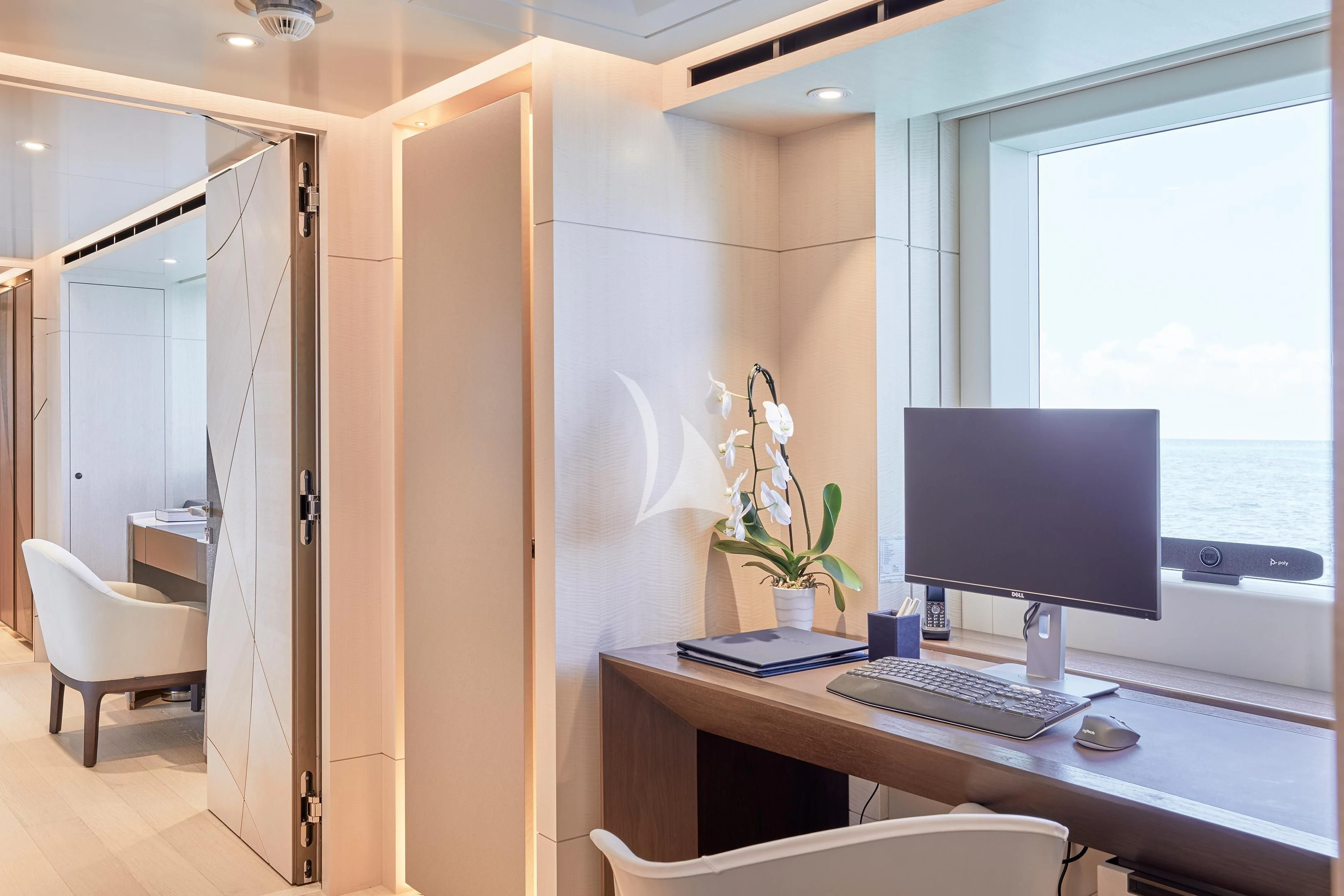 a desk with a computer on it aboard ARKADIA Yacht for Charter