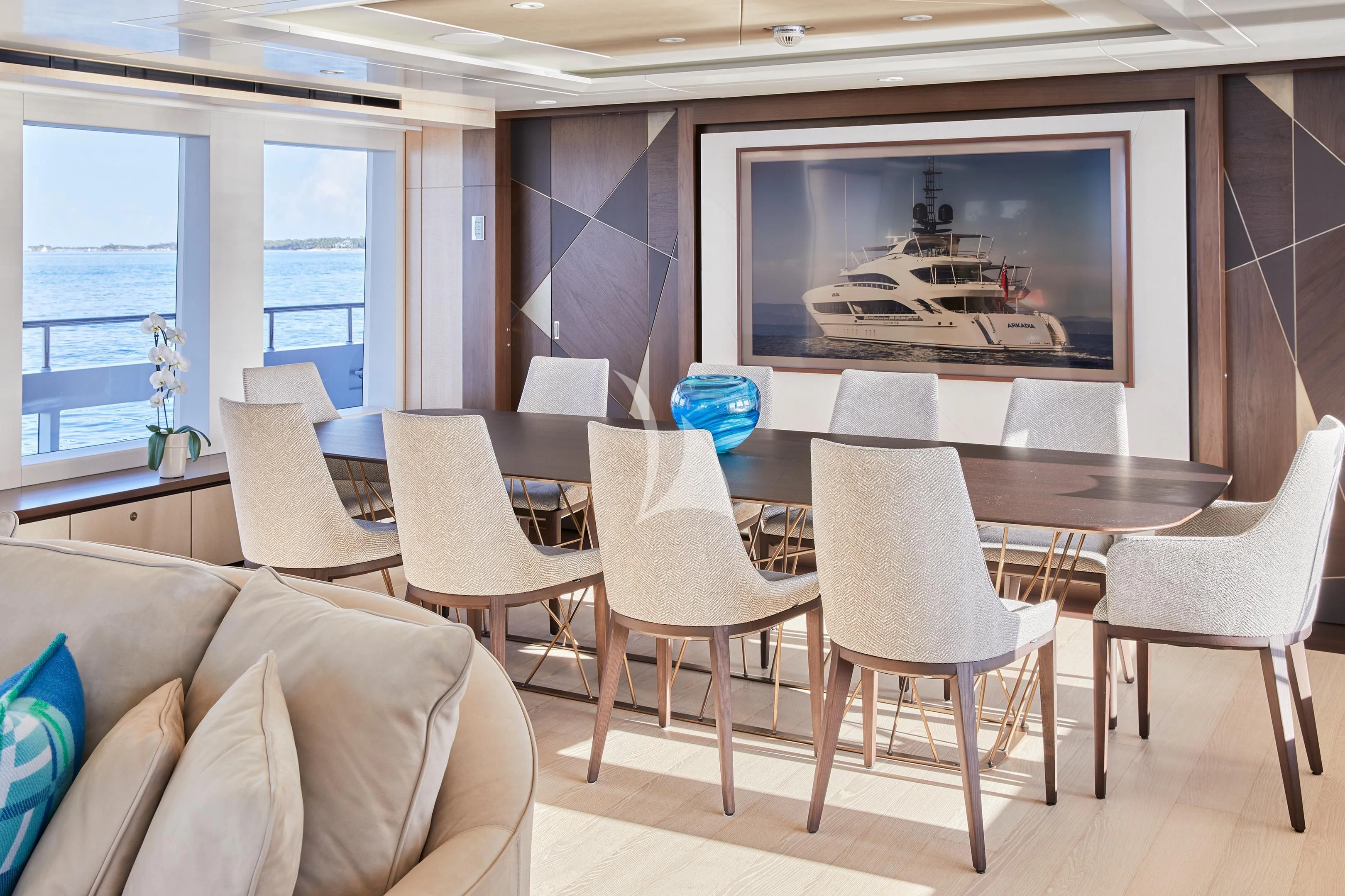 a room with chairs and a table aboard ARKADIA Yacht for Charter