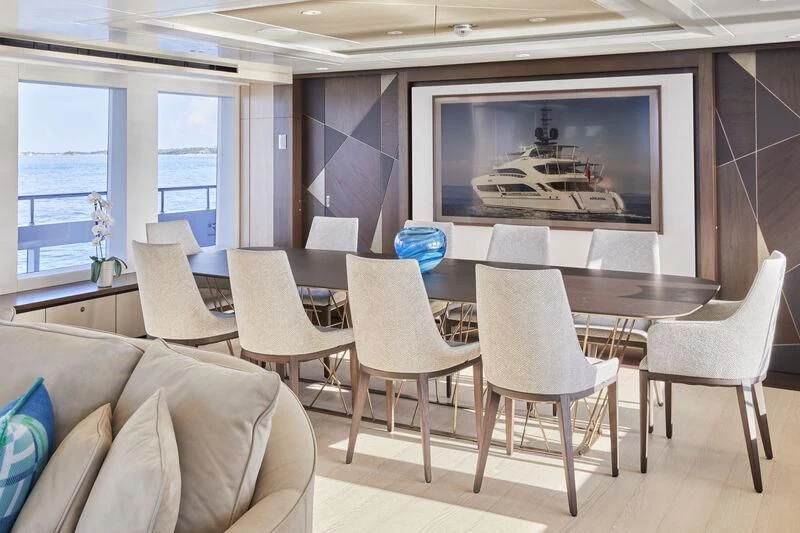 a room with chairs and a table aboard ARKADIA Yacht for Charter