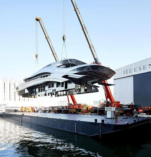 a large boat docked at a pier aboard ARKADIA Yacht for Charter