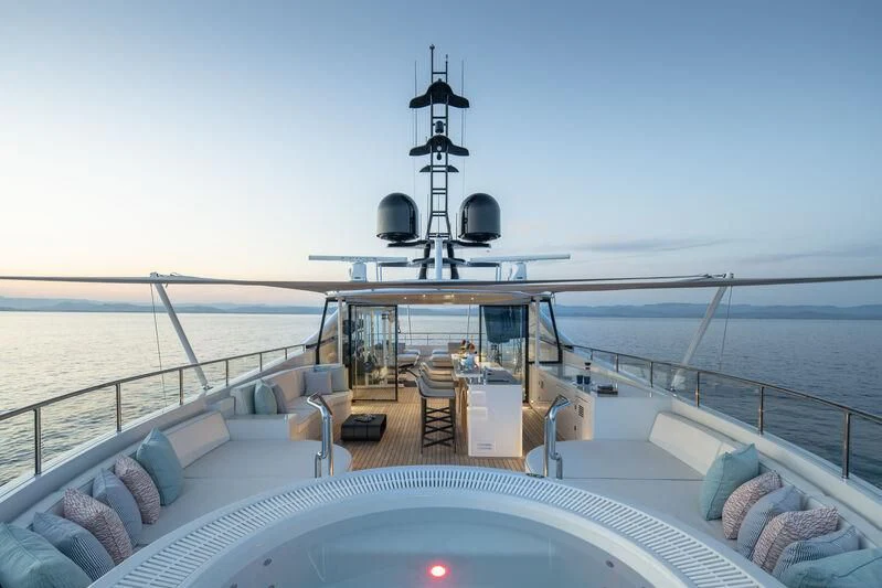 a deck with a large ship and a large antenna on it aboard ARKADIA Yacht for Charter