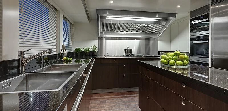 a kitchen with a large island aboard ARKADIA Yacht for Charter