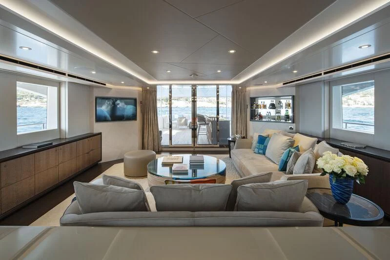 a living room with a large window aboard ARKADIA Yacht for Charter