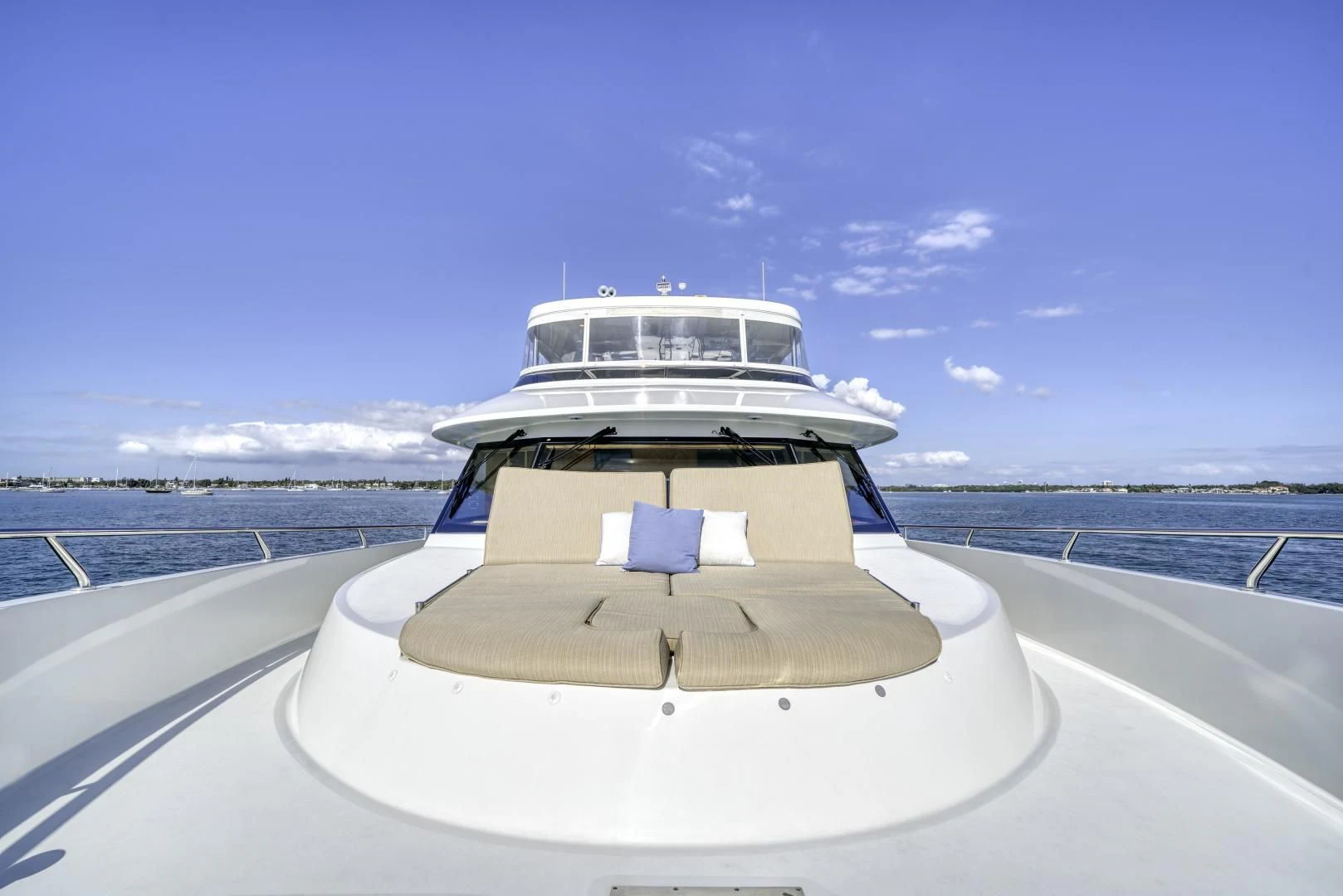 a white boat on a beach aboard SANCTUARY Yacht for Sale