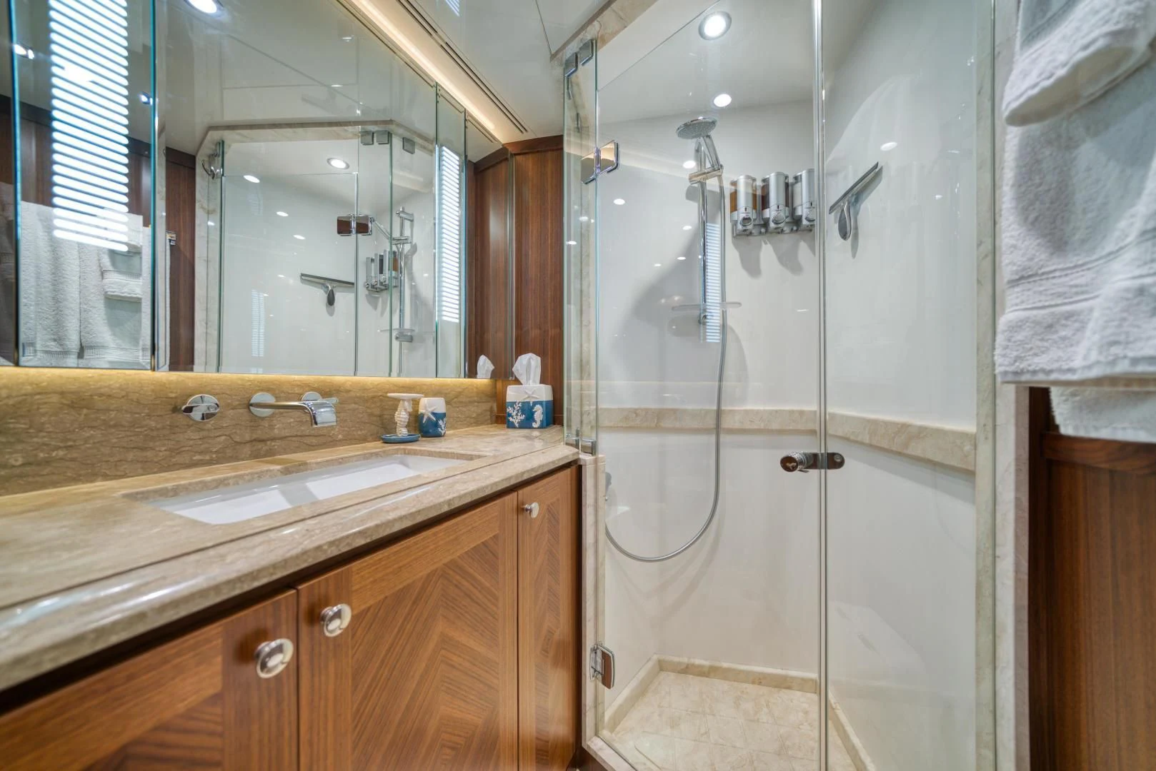 a bathroom with a glass shower aboard SANCTUARY Yacht for Sale
