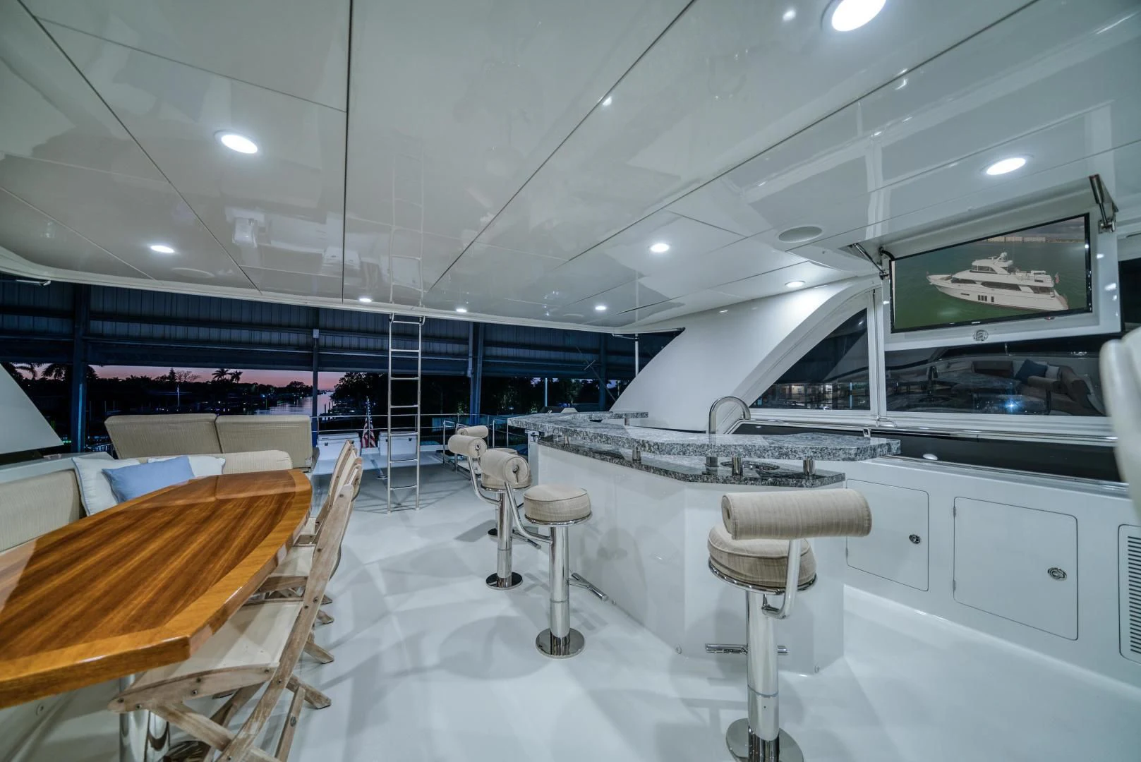 a room with tables and chairs aboard SANCTUARY Yacht for Sale
