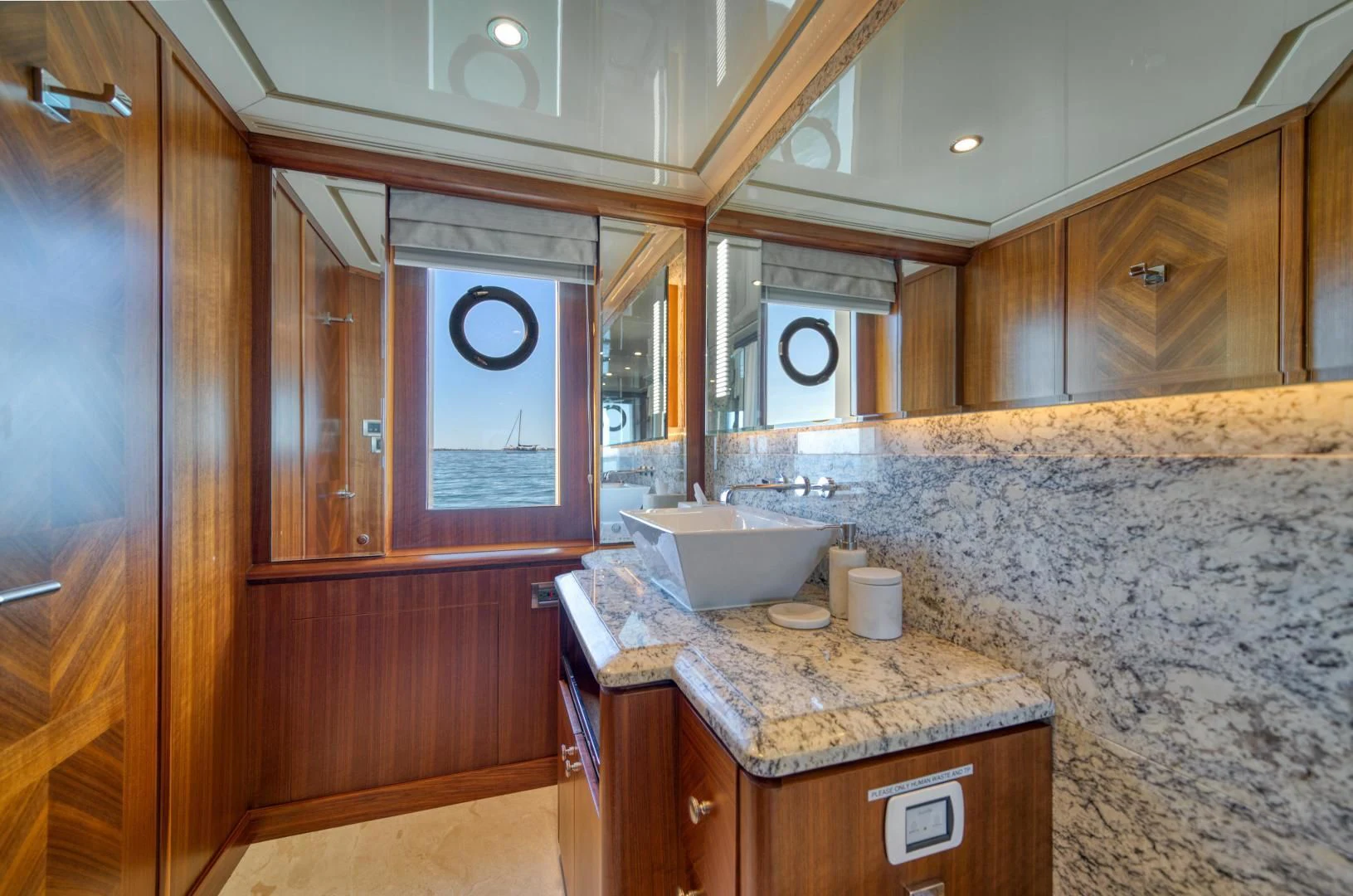 a bathroom with a marble counter top aboard SANCTUARY Yacht for Sale