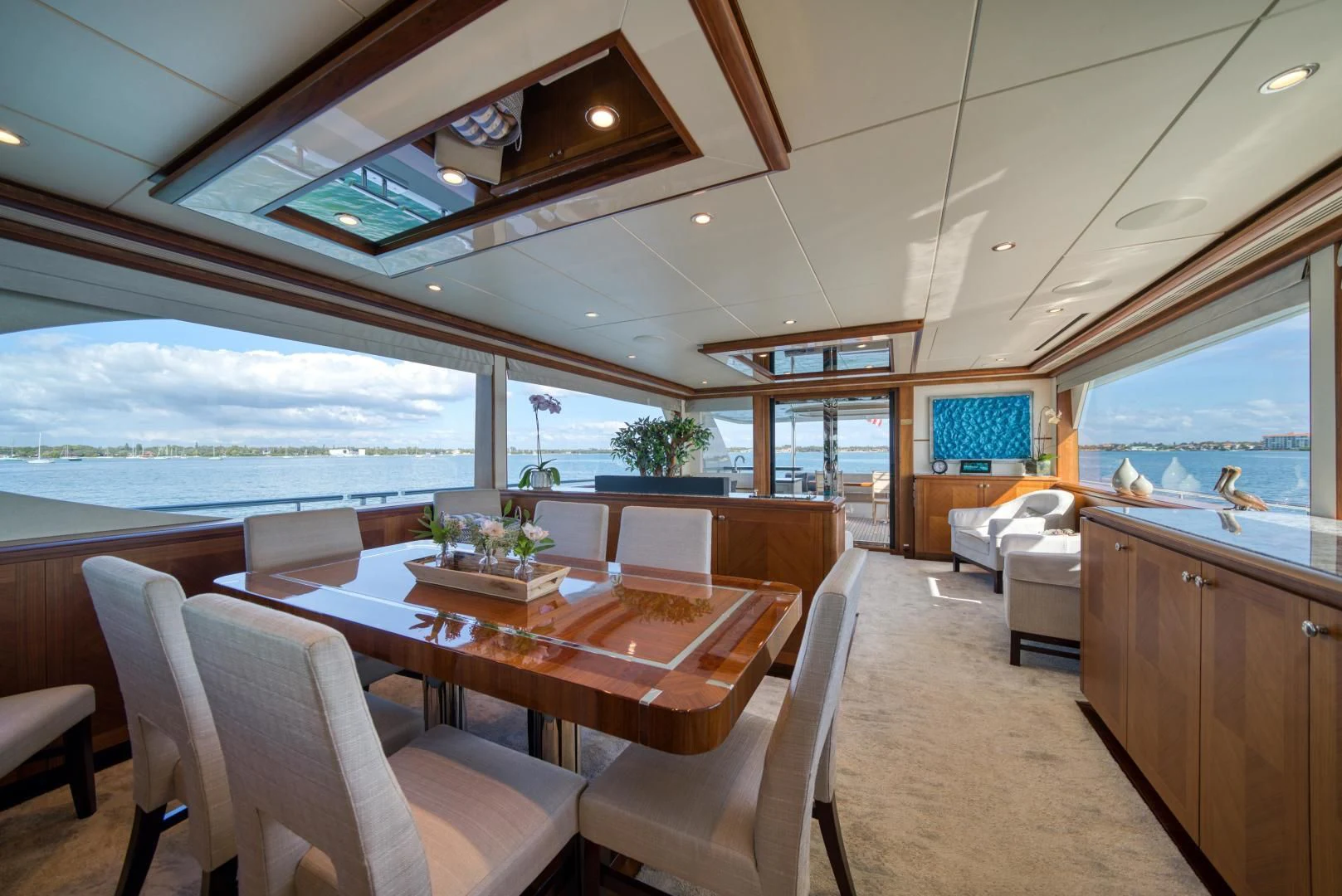 a large room with a table and chairs aboard SANCTUARY Yacht for Sale