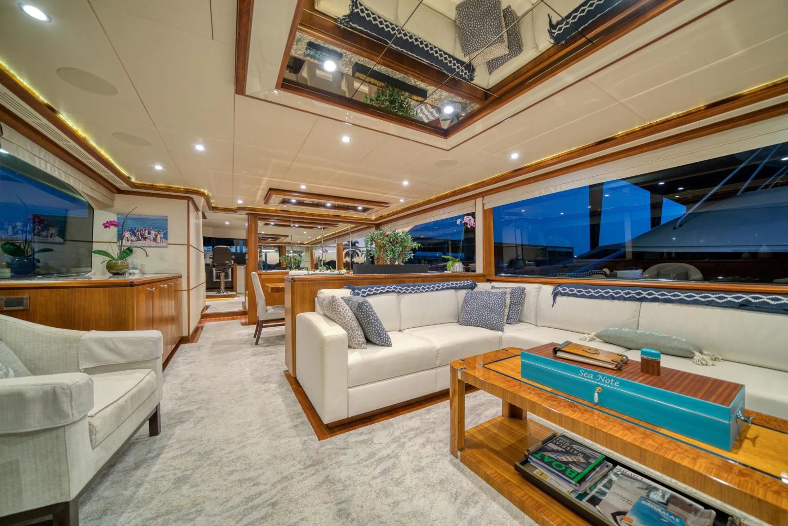 a living room with a large open ceiling aboard SANCTUARY Yacht for Sale