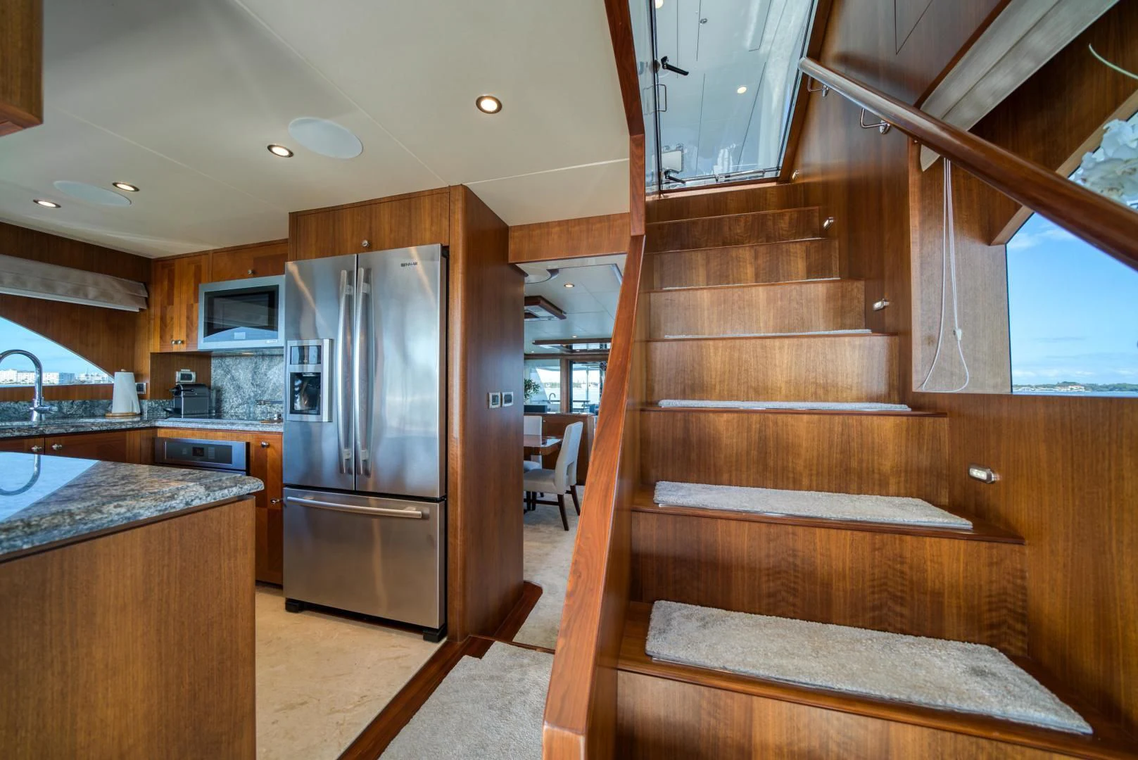 a kitchen with wood cabinets aboard SANCTUARY Yacht for Sale