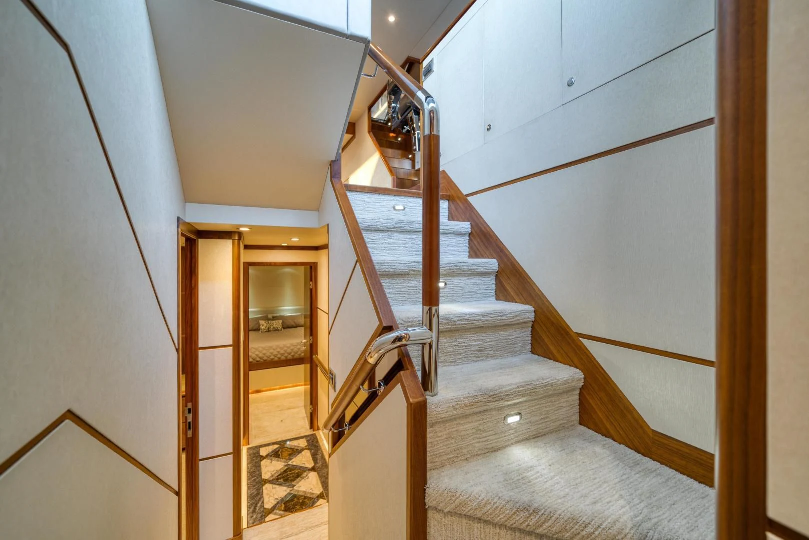 a staircase with wooden railings aboard SANCTUARY Yacht for Sale