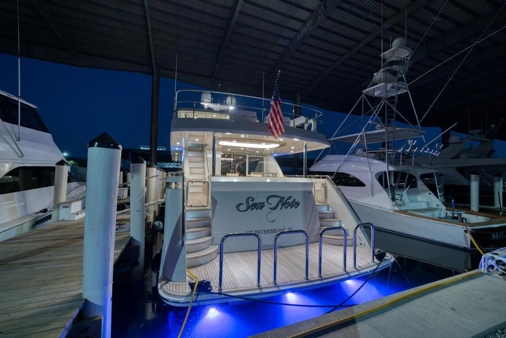 a boat docked at a pier aboard SANCTUARY Yacht for Sale