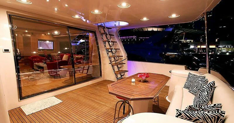 a room with a table and chairs aboard DURETTI 85 Yacht for Sale