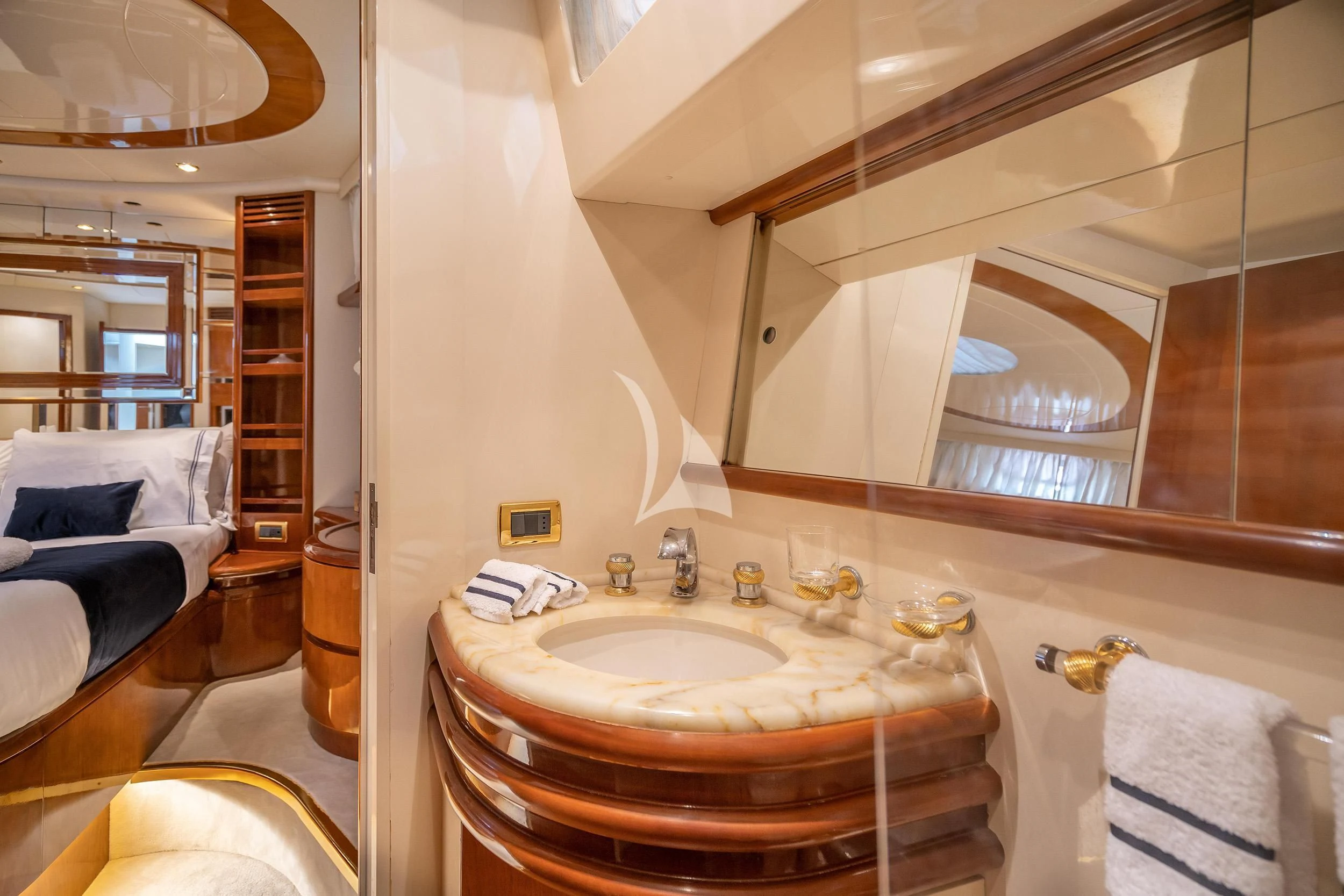 a bathroom with a sink and a mirror aboard ESTIA ZEUS Yacht for Charter