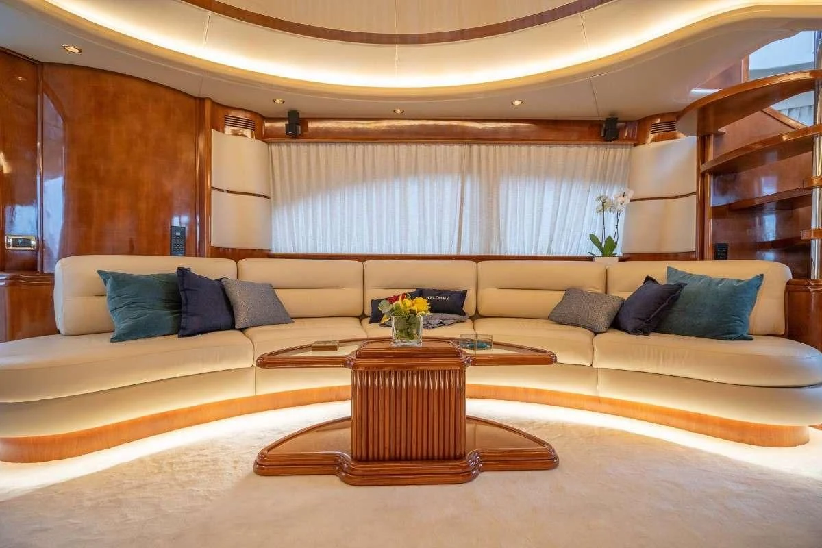 a living room with a couch and a coffee table aboard ESTIA ZEUS Yacht for Charter