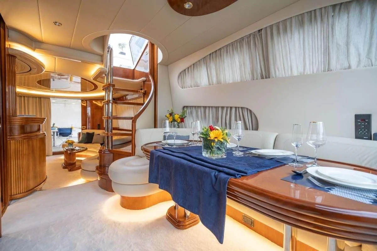 a dining room with a table and chairs aboard ESTIA ZEUS Yacht for Charter