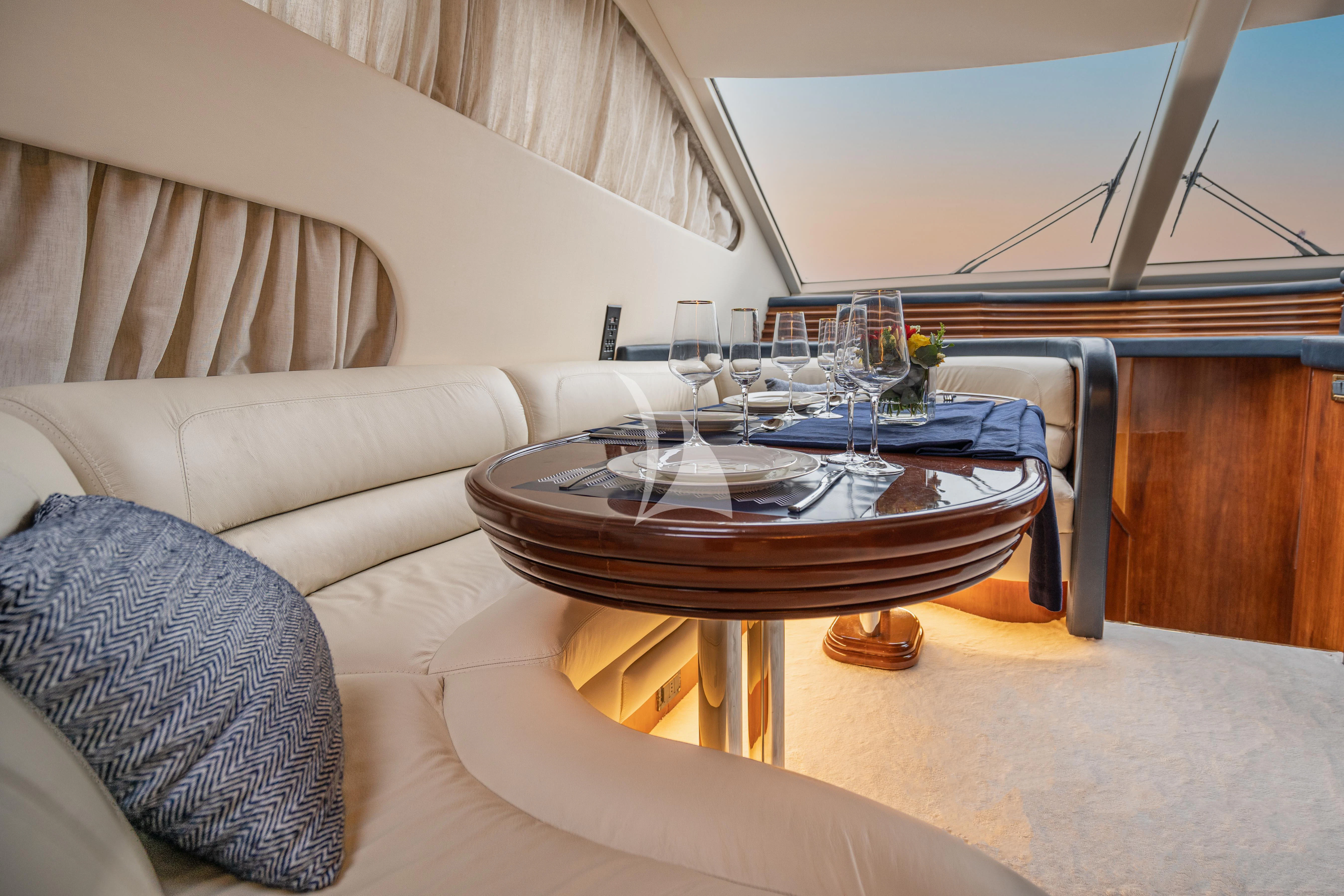 a table with a glass on it aboard ESTIA ZEUS Yacht for Charter