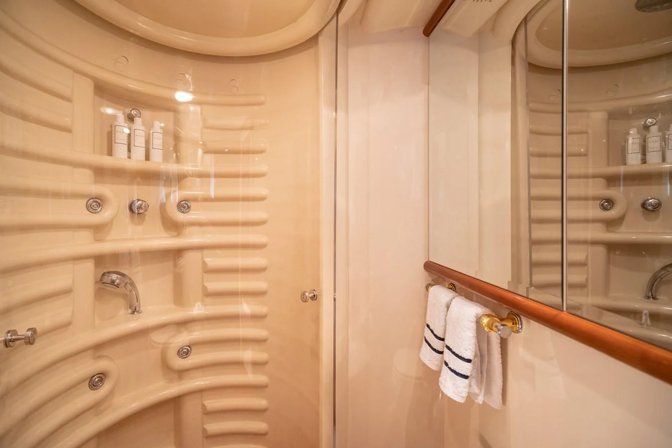 a bathroom with a glass shower aboard ESTIA ZEUS Yacht for Charter