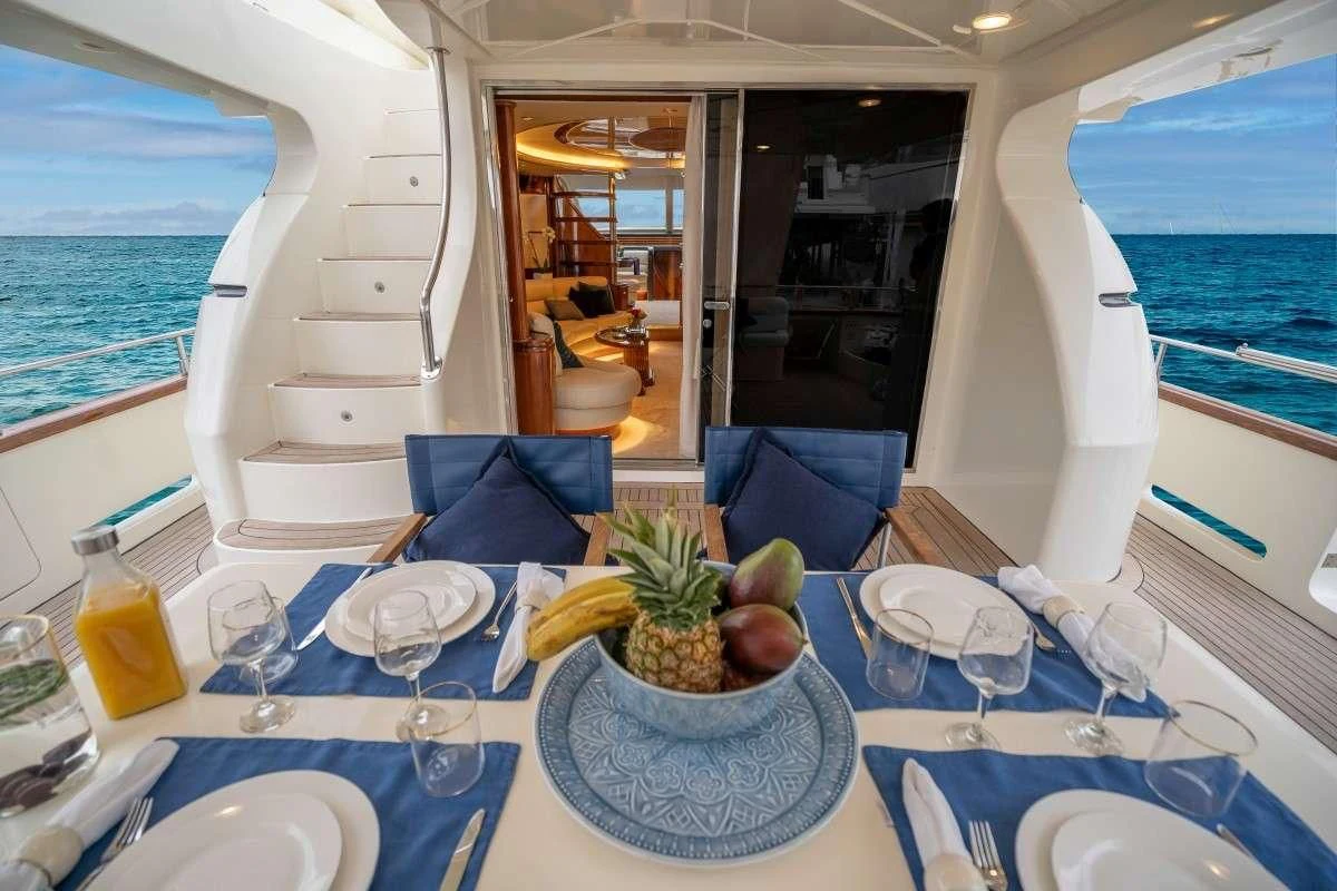 a table with a bowl of fruit on it aboard ESTIA ZEUS Yacht for Charter