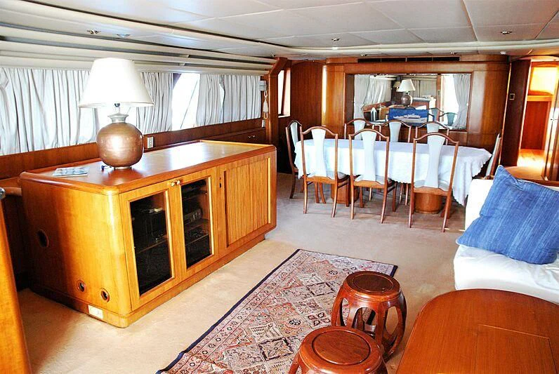 a large wooden cabinet in a living room aboard NINETY TWO Yacht for Sale