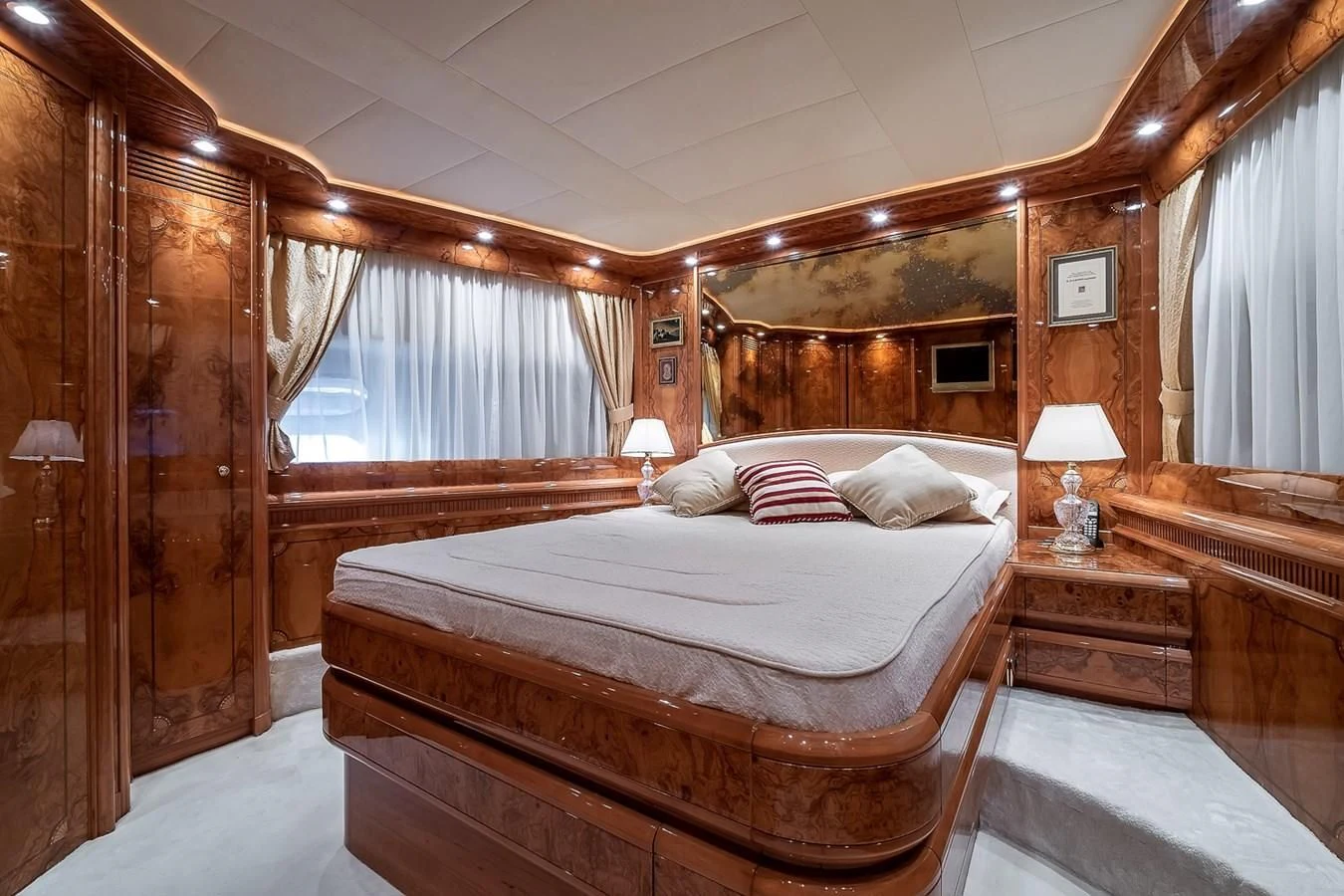 a large bedroom with a bed aboard LADY ADELHEID Yacht for Sale