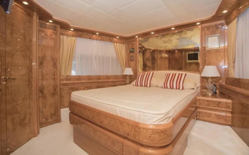 a large bedroom with a bed aboard LADY ADELHEID Yacht for Sale