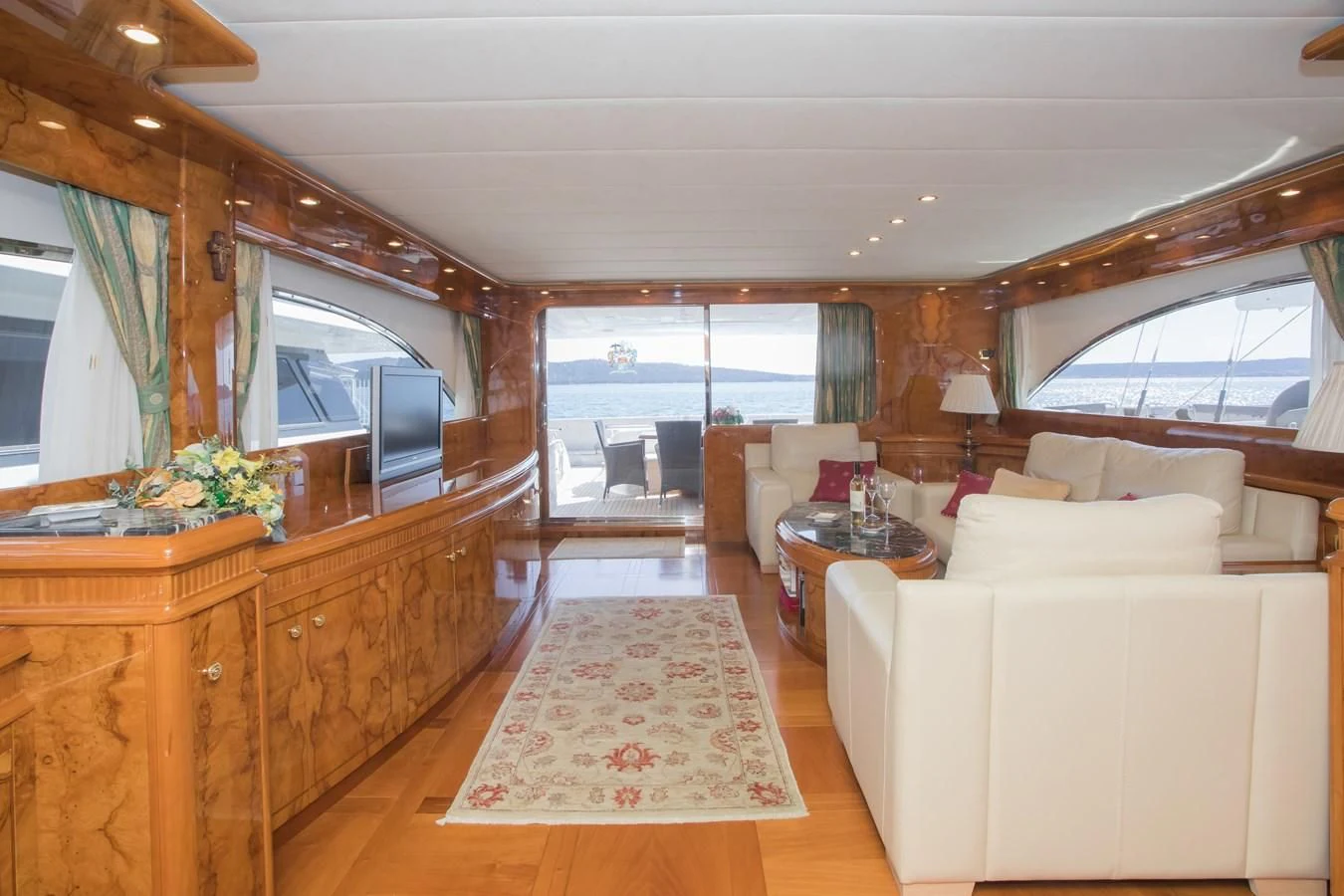 a living room with a large window aboard LADY ADELHEID Yacht for Sale