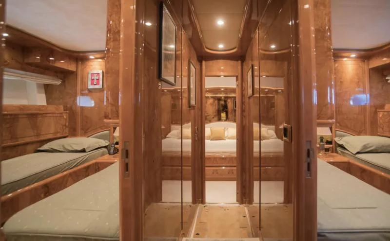 a room with a bed and a mirror aboard LADY ADELHEID Yacht for Sale