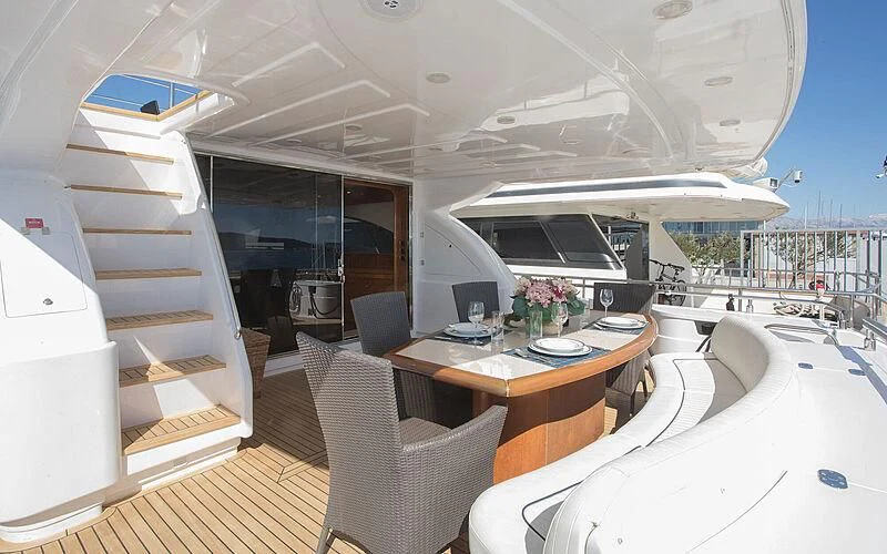 a room with a table and chairs aboard LADY ADELHEID Yacht for Sale