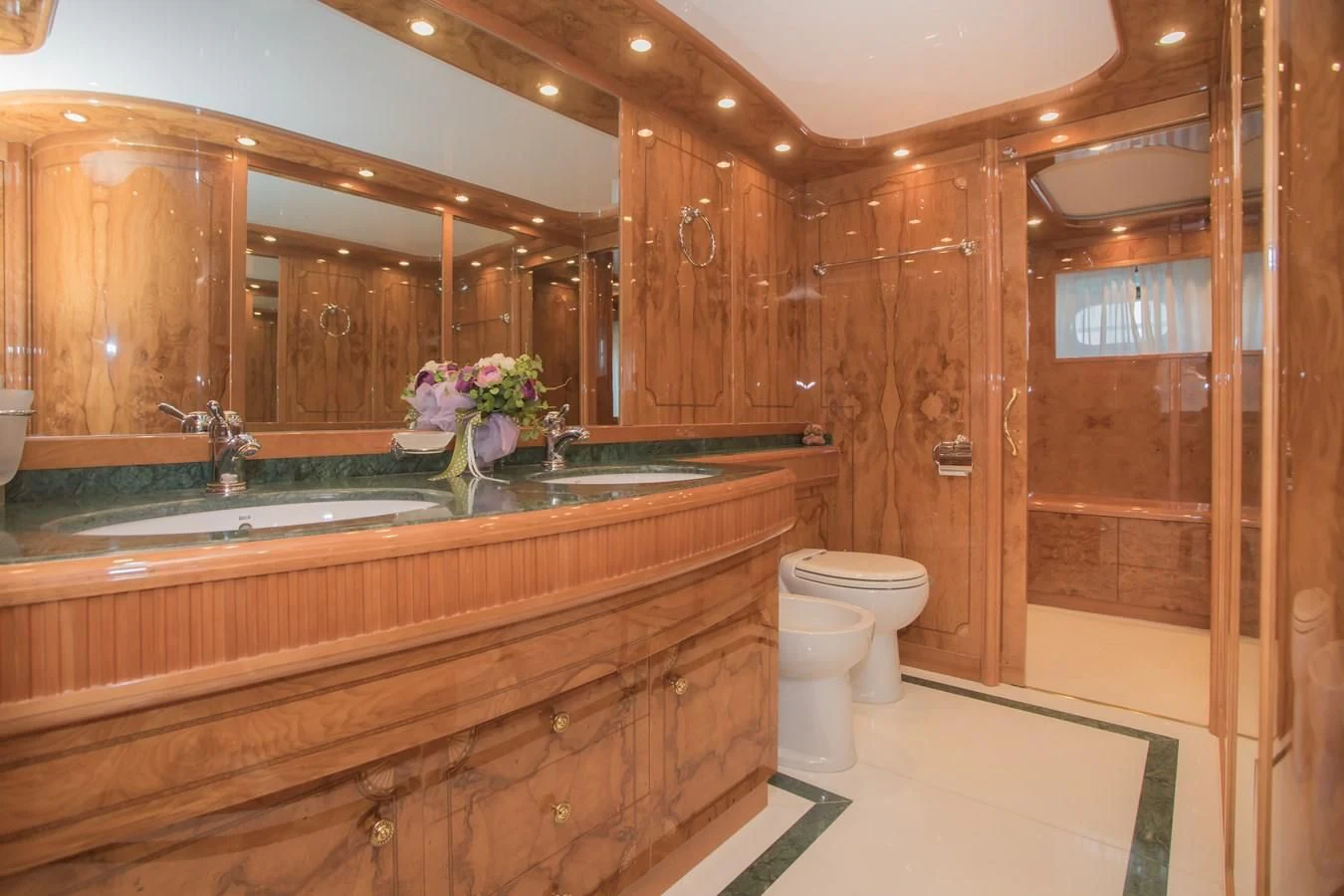 a bathroom with a glass shower aboard LADY ADELHEID Yacht for Sale