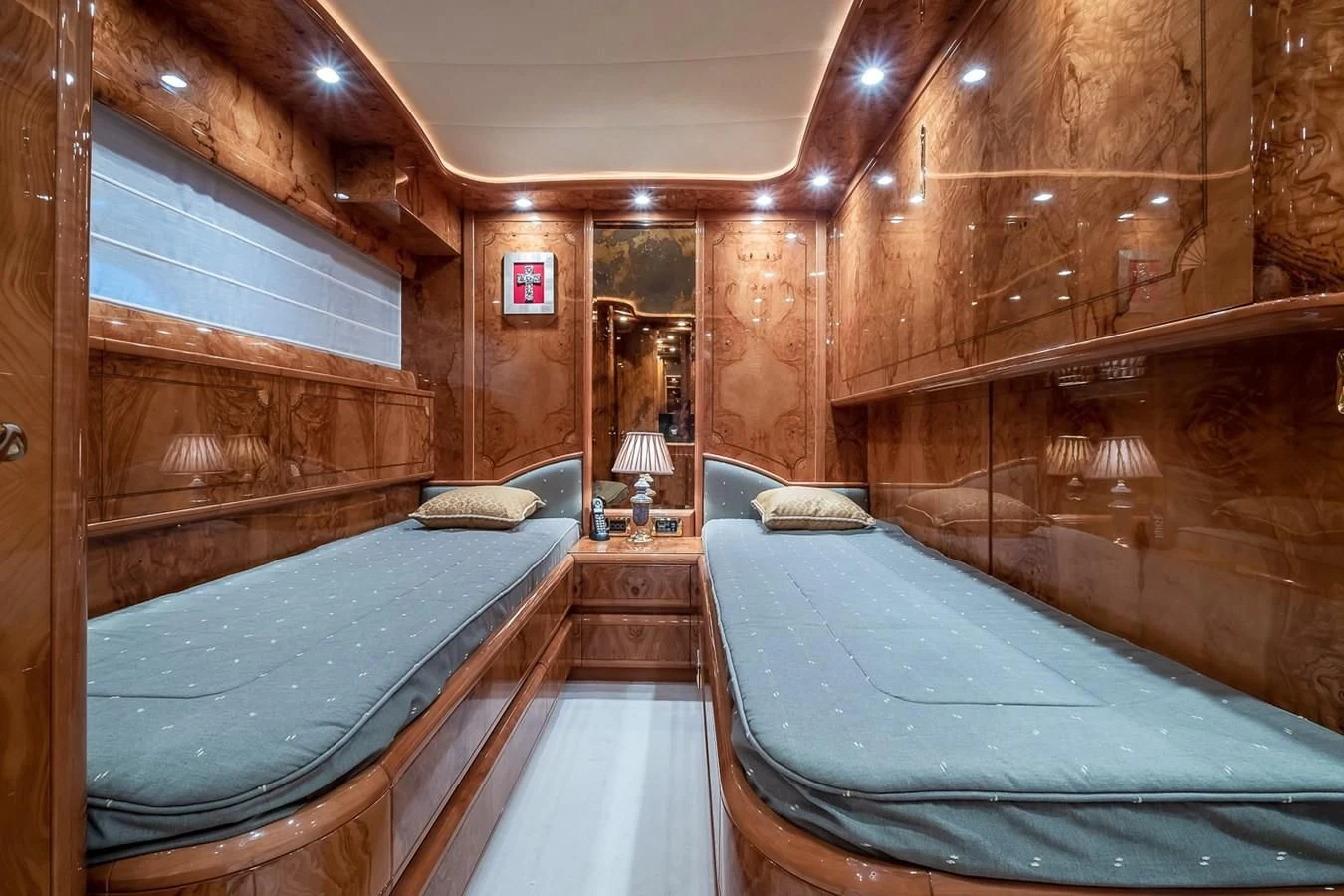 a room with wooden walls and a couple of beds aboard LADY ADELHEID Yacht for Sale