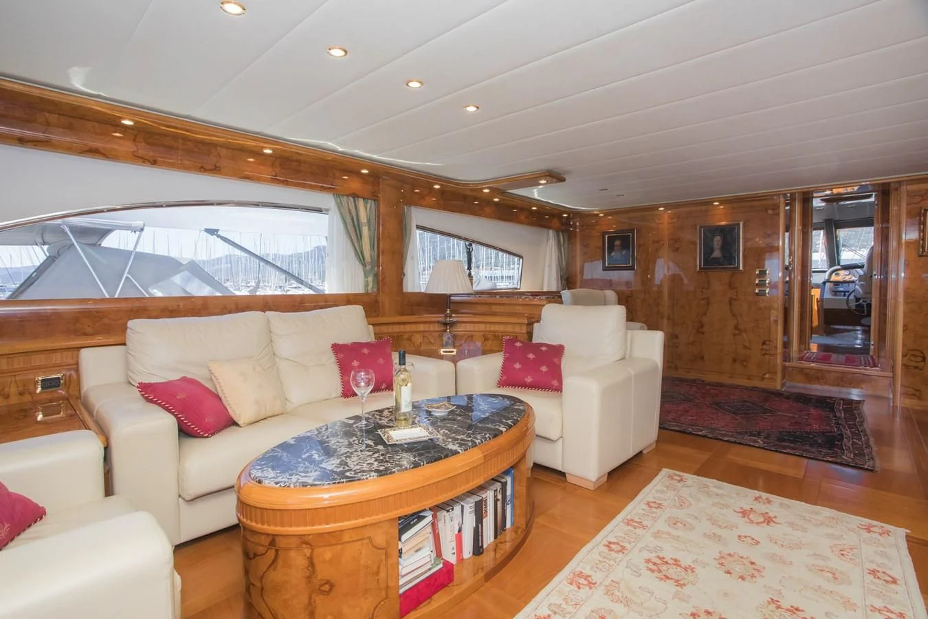 a living room with a couch and a table aboard LADY ADELHEID Yacht for Sale