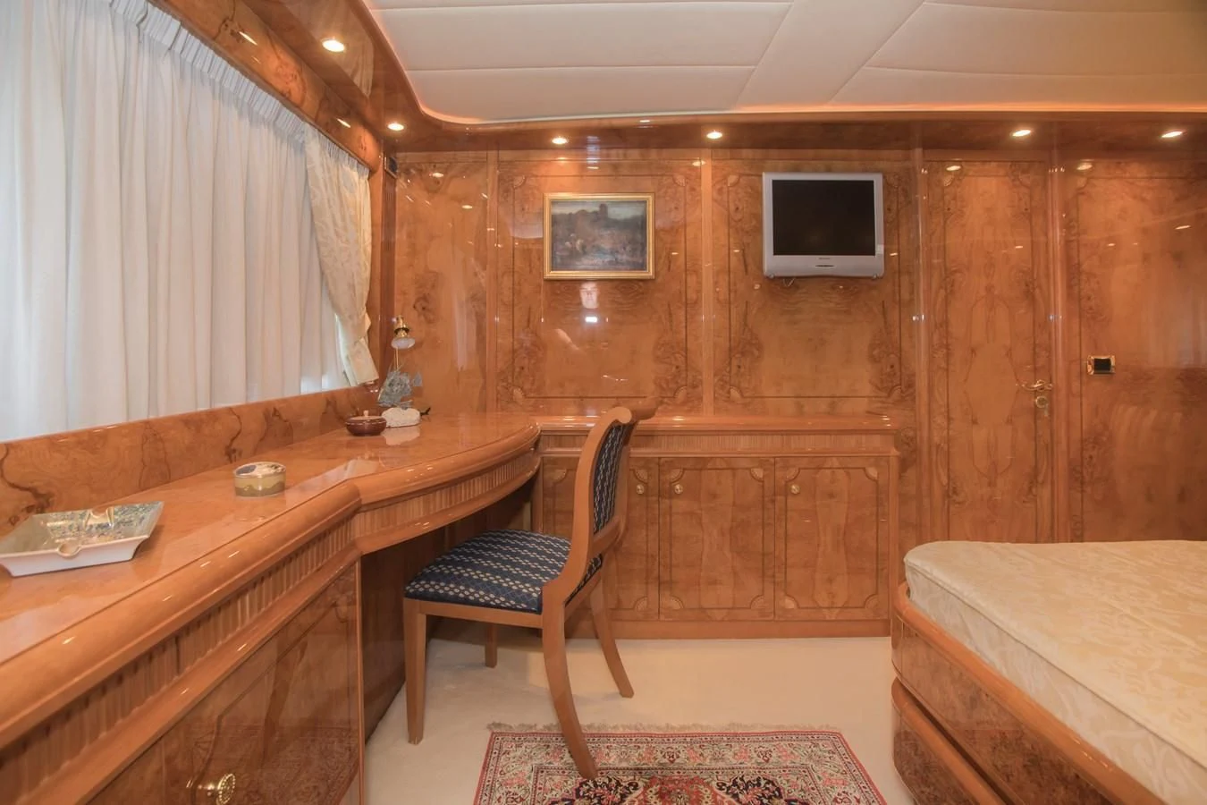 a room with a desk and a tv aboard LADY ADELHEID Yacht for Sale