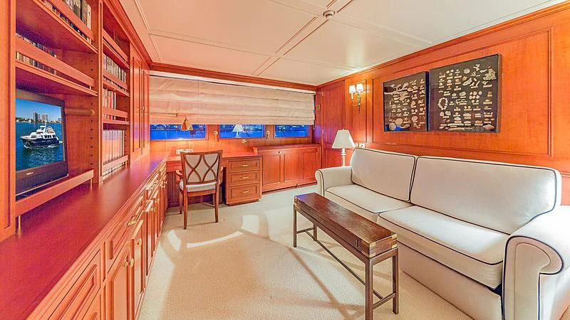 a living room with a couch and a television aboard CASUAL WATER Yacht for Sale