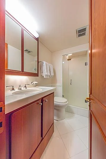 a bathroom with a sink toilet and a mirror aboard CASUAL WATER Yacht for Sale