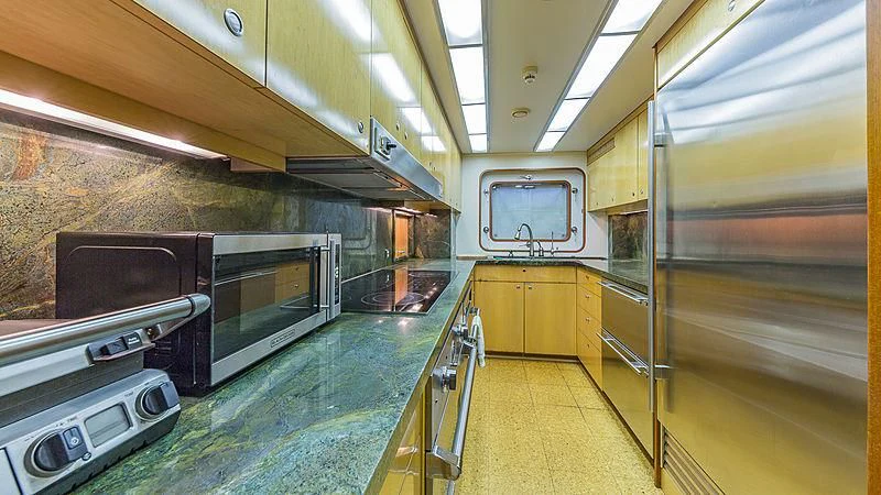 a kitchen with stainless steel appliances aboard CASUAL WATER Yacht for Sale