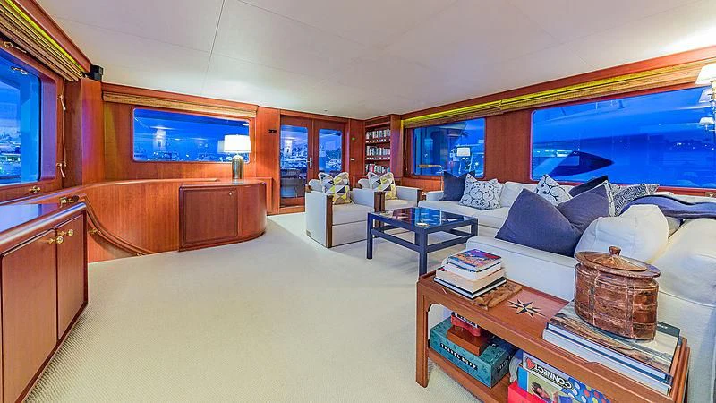 a bedroom with a bed and a table aboard CASUAL WATER Yacht for Sale