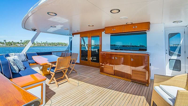 a room with a couch and a television aboard CASUAL WATER Yacht for Sale