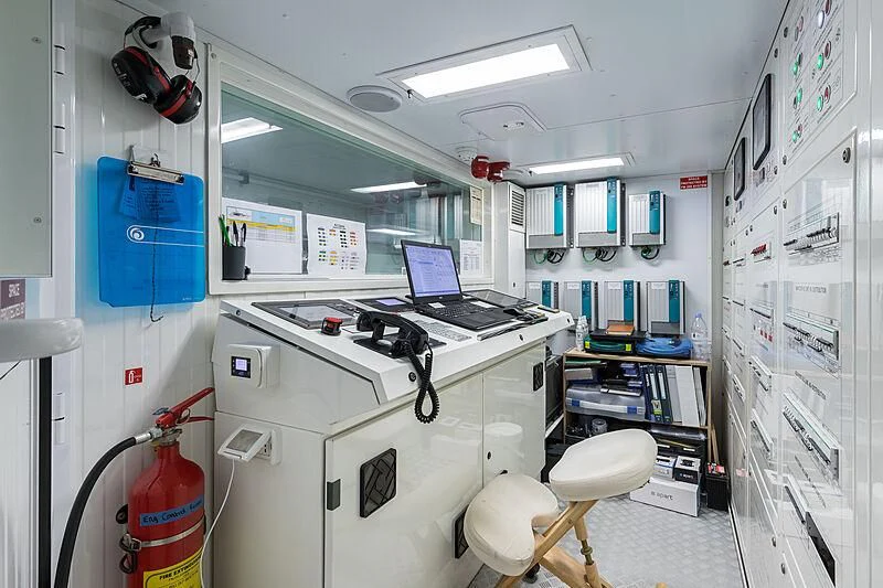a laptop on a machine aboard BOMBAY Yacht for Sale