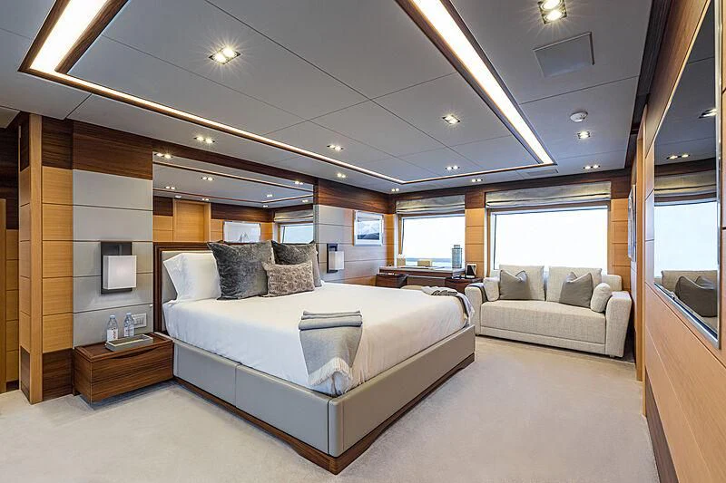 a large bed in a room aboard BOMBAY Yacht for Sale