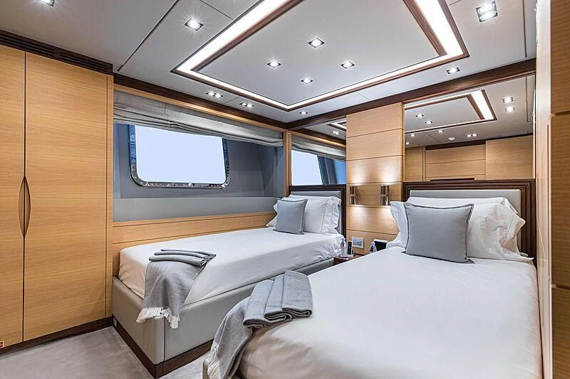 a room with two beds aboard BOMBAY Yacht for Sale
