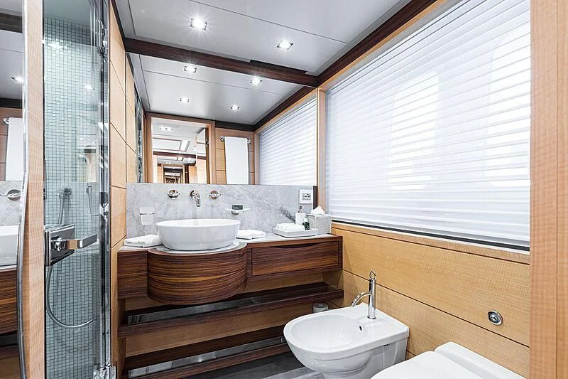 a bathroom with a sink and a mirror aboard BOMBAY Yacht for Sale