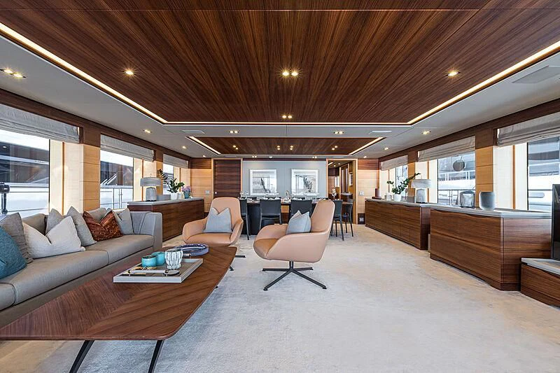 a living room with a couch and a coffee table aboard BOMBAY Yacht for Sale